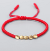 Bracelet tibétain corde rouge et de perles en cuivre